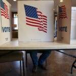 A Sioux Falls resident votes in the city and school board election at Southern Hills United Methodist Church on April 9, 2024. (Makenzie Huber/South Dakota Searchlight)