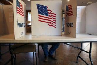 A Sioux Falls resident votes in the city and school board election at Southern Hills United Methodist Church on April 9, 2024. (Makenzie Huber/South Dakota Searchlight)