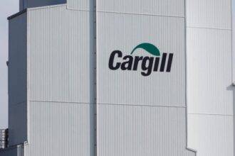 The Cargill logo is displayed on the exterior of a factory in Lucens, Switzerland.