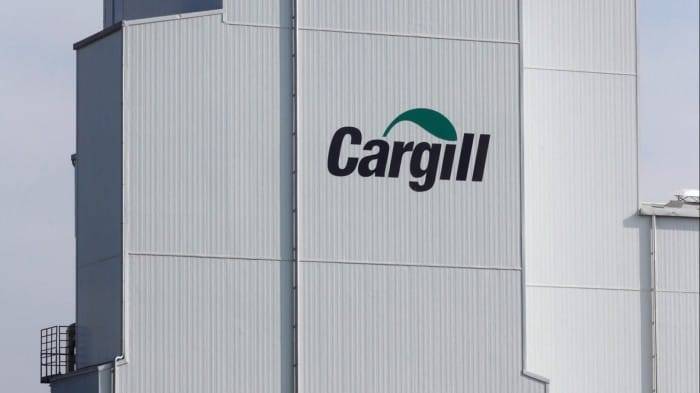 The Cargill logo is displayed on the exterior of a factory in Lucens, Switzerland.